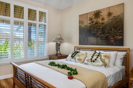 Escape to a tranquil bedroom with soft, tropical-inspired decor for restful nights.