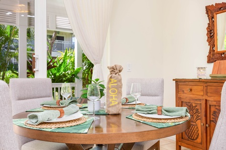Cozy dining setup with tropical-themed accents and outdoor connection.