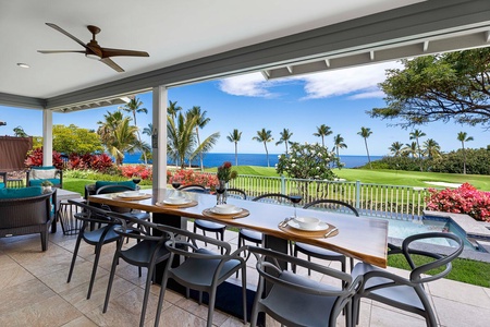 Dining area with a picturesque view of the ocean, ideal for breezy summer meals.