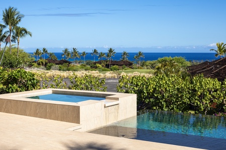 Contemporary design elements delight the senses, like this overflow waterfall from private spa to infinity pool.