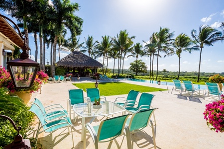 Enjoy poolside relaxation with a cool drink.