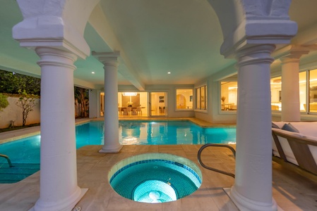 Private spa and pool area with Greco-inspired columns, ideal for a relaxing soak at any hour.