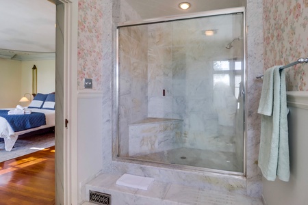 The ensuite bathroom has a separate walk-in shower.