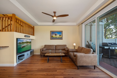 The living room opens to the patio, bringing in natural light and fresh air.