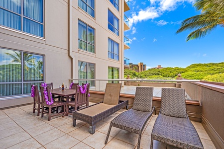 Lounge or dine on the spacious lanai at Honua Kai Konea 232 with cushioned seating and a dining set.