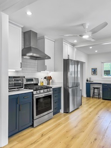 Fully-stocked kitchen with top-tiered appliances for your culinary ventures.