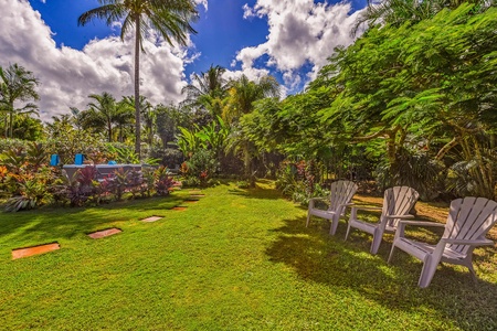 Spacious lawn with seating, ideal for family games, picnics, and stargazing nights.
