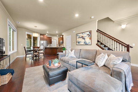 Modern comfort meets classic charm in this bright living and dining space, designed for togetherness.