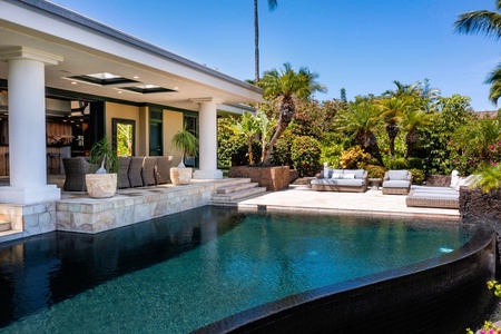 Swim, lounge, or dine beside your private pool in a lush tropical setting.
