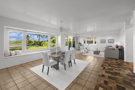 This open-concept floor plan is aptly fit for entertaining, complete with living room, dining area, and library