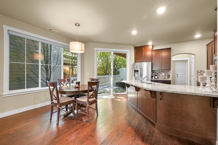 The open-concept dining area flows seamlessly into the kitchen—ideal for shared meals or takeout from nearby eateries.