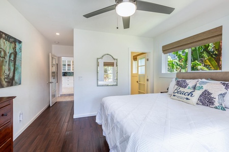 Designed for comfort and flexibility, this guest bedroom offers a double bed and an ensuite bathroom with a walk-in shower.