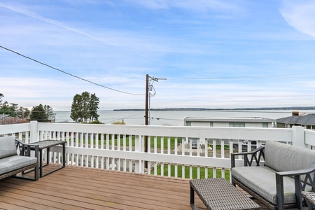 Unwind on your private deck with stunning ocean views and comfortable seating, perfect for morning coffee or sunset cocktails.