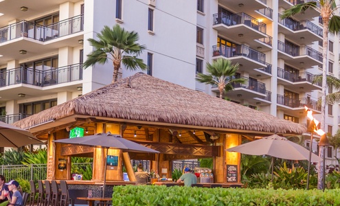 Private Beach Bar with Stools and Outdoor Dining Tables Sets with Table Umbrellas.