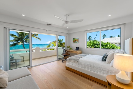 Bright and open, this guest room offers a queen bed, private lanai, and an inspiring view of the palm-fringed coast.