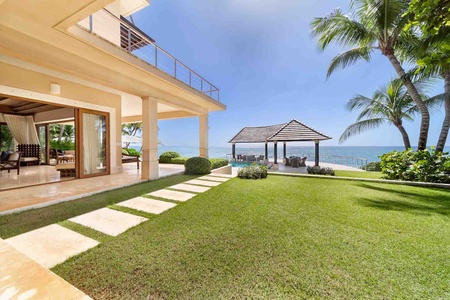 Relax in the outdoor cabana with ocean views.