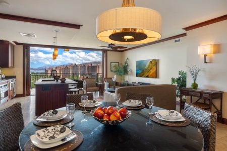 The open-concept great room blends elegance and comfort with tropical furnishings and natural light.