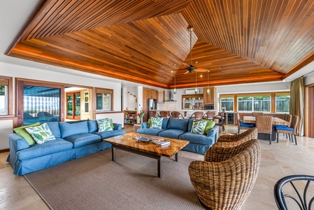 Comfortable coastal furnishings open to the poolside terrace—perfect for entertaining or quiet relaxation.