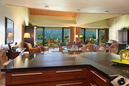 Prepare meals while enjoying panoramic views from the open-concept kitchen and dining area.