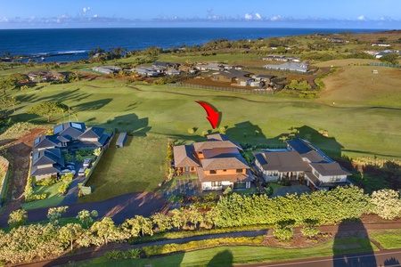 Aerial view showing the home’s oceanfront position along the fairway.