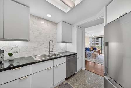 Whip up island breakfasts in the refreshed kitchen with sleek finishes and ample storage.
