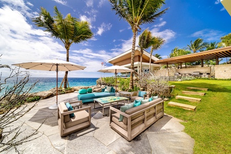 Enjoy the stunning beachfront views in the spacious outdoor seating areas.