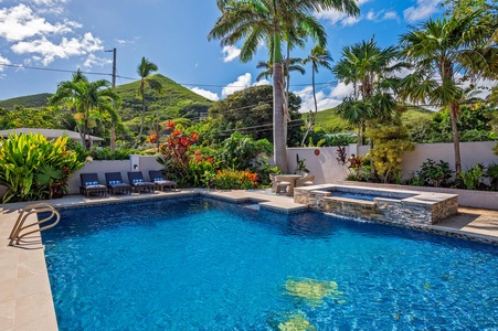 Lush backyard with large pool deck and pool give you all the feels of having your own private mini hotel!  (Note: Upper pool area is apart of the pool and NOT a spa)