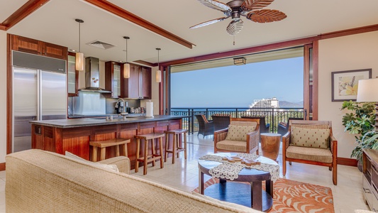Spacious open-concept living area with gourmet kitchen, offering seamless island living and stunning views.