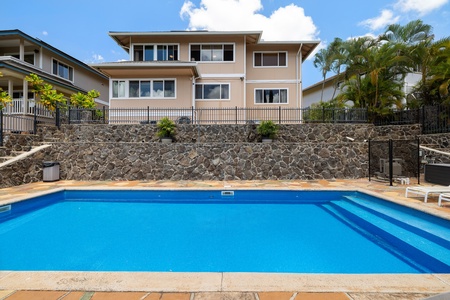 The lower-level pool sits directly below the home, creating an elevated terrace effect with gorgeous views and easy access.