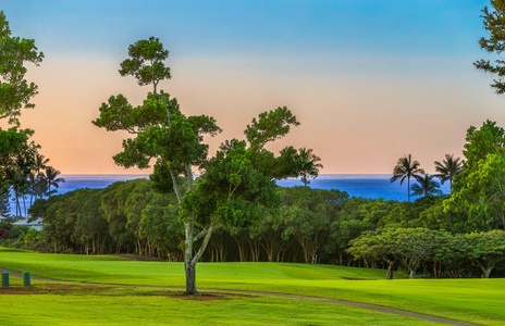 Expansive sunset views of the golf course and distant ocean, seen directly from the comfort of your private lanai.