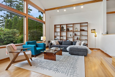 Modern meets comfort in this bright living space, ideal for relaxation or catching up on your favorite book.