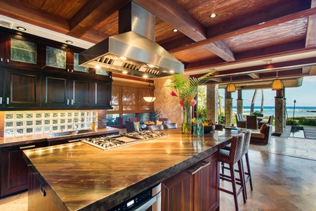A welcoming courtyard framed by lush gardens sets the tone for a peaceful island retreat.