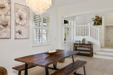 Stylish dining area with a rustic wooden table and contemporary decor.