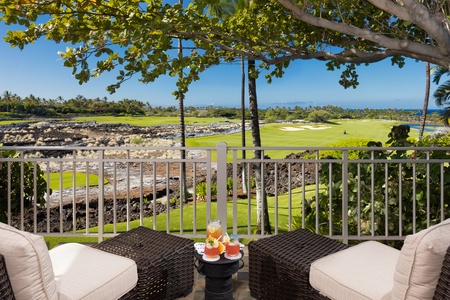 Outdoor seating for two on the Primary Bedroom lanai overlooking lush landscapes and serene golf course vistas.