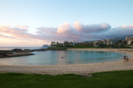 Sandy beaches and green grass at the crystal blue lagoon.