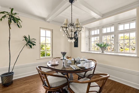 Enjoy morning sunlight in the inviting breakfast nook, where relaxed seating for four offers the perfect spot to savor your morning coffee or enjoy intimate, casual dining.