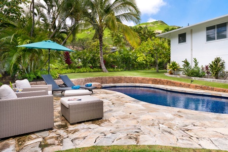 Enjoy a refreshing dip in the in-ground pool, perfect for lazy afternoons and family fun.