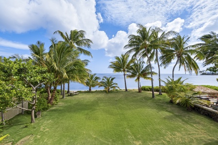 Tropical garden area overlooking the serene ocean.