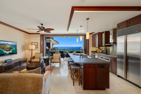 Wide-angle view reveals full great room and shimmering horizon.
