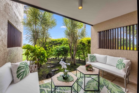 Step out from the primary suite to this private garden terrace—a peaceful space surrounded by lush tropical foliage.