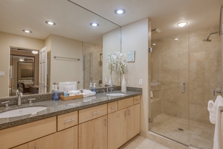 Walk-in shower in the primary suite adds spa-like comfort to your daily island routine.