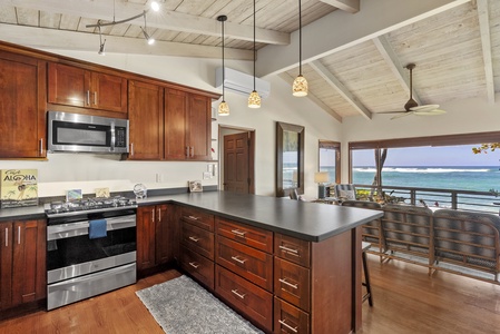 Open-concept kitchen with bar seating, ideal for casual breakfasts or evening cocktails.