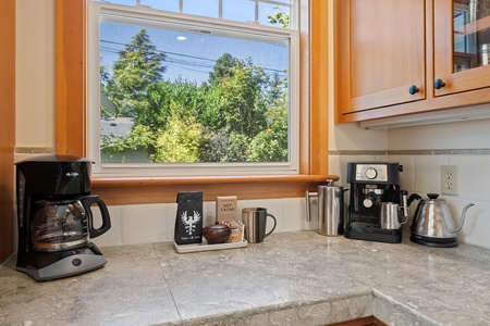 A delightful spot, our coffee corner, offering everything you need to brew your favorite morning pick-me-up.