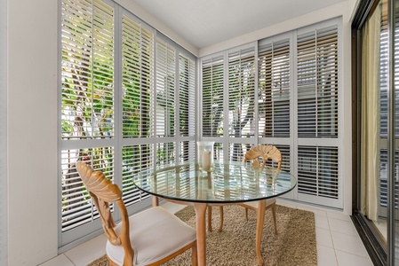 The breakfast nook has seating for two with garden views.