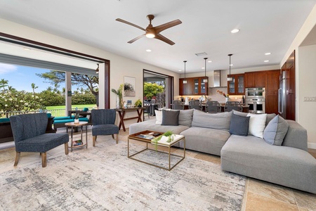 Open concept living space seamlessly blending modern lounge and kitchen areas.