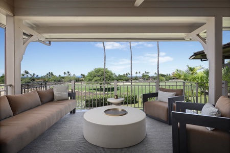 The lanai overlooks the Ka’ulu Villa greenery and the horizon.