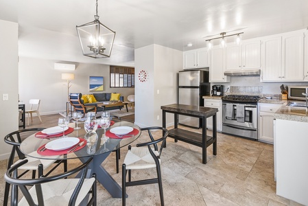 The dining area is conveniently located off the kitchen, offering plenty of space to enjoy meals together.