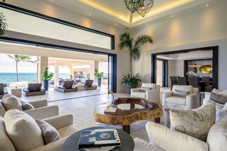 Indoor-outdoor living in this spacious, airy lounge with plush seating and stunning ocean views.