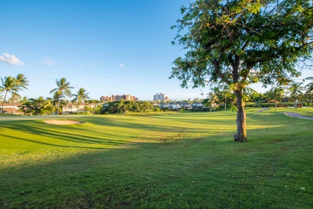 Expansive green fairways stretch across the Ko Olina golf course.