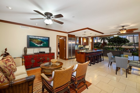 An open floor plan with seating at the kitchen bar.